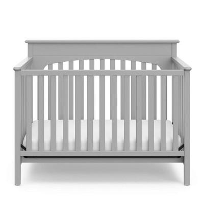 wooden cradle price with crown design deep enough for a baby to play independently