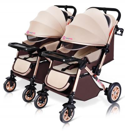 twins pram with big foot rest well cushioned accessorised with bottle holder and food tray